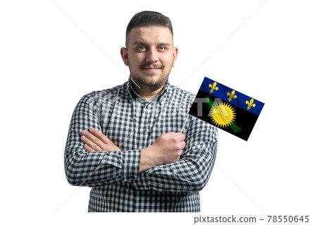 White guy holding a flag of Guadeloupe smiling confident with crossed arms isolated on a white background White guy holding a flag of Guadeloupe smiling confident with crossed arms isolated on a white background 78550645