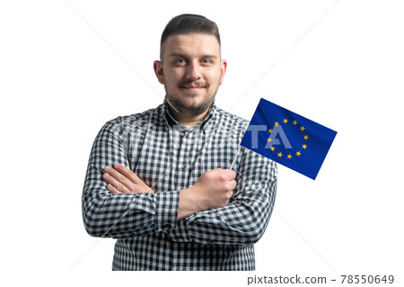 White guy holding a flag of European Union smiling confident with crossed arms isolated on a white background White guy holding a flag of European Union smiling confident with crossed arms isolated on a white background 78550649