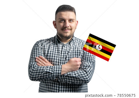 White guy holding a flag of Uganda smiling confident with crossed arms isolated on a white background White guy holding a flag of Uganda smiling confident with crossed arms isolated on a white background 78550675