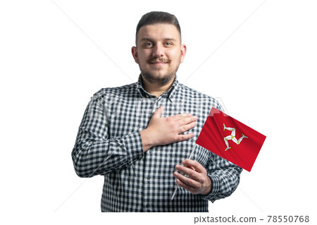 White guy holding a flag of Isle of Man and holds his hand on his heart isolated on a white background With love to Isle of Man White guy holding a flag of Isle of Man and holds his hand on his heart isolated on a white background With love to Isle of Man 78550768
