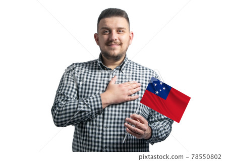 White guy holding a flag of Samoa and holds his hand on his heart isolated on a white background With love to Samoa 78550802