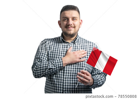 White guy holding a flag of Peru and holds his hand on his heart isolated on a white background With love to Peru White guy holding a flag of Peru and holds his hand on his heart isolated on a white background With love to Peru 78550808