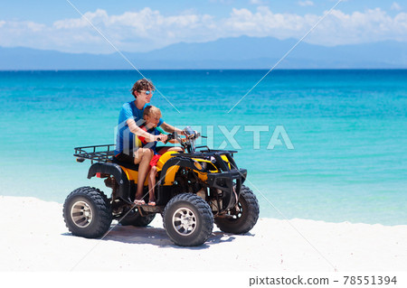 Kids on quad bike. Off road all terrain vehicle. Kids on quad bike. Off road all terrain vehicle. 78551394