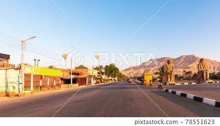 Colossi of Memnon, famous statues on the road to Luxor Necropolis, Egypt 78551623