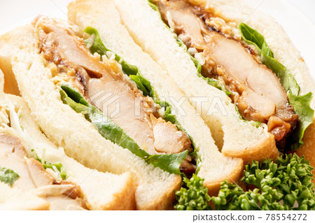 Close-up of teriyaki chicken sandwich. 78554272