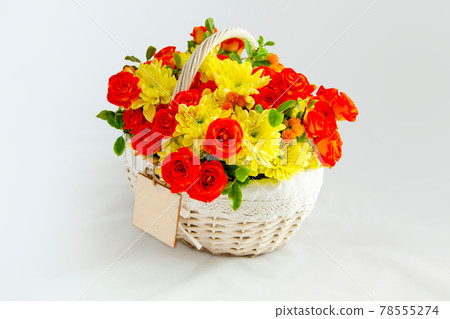 white basket with scarlet roses and yellow chrysanthemums. beautiful gift. flovers for cut out white background white basket with scarlet roses and yellow chrysanthemums. beautiful gift. flovers for cut out white background 78555274