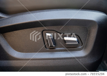 car seat electronic switch button. lever for electronic seat adjustment in a modern premium car. seat memory option car seat electronic switch button. lever for electronic seat adjustment in a modern premium car. seat memory option 78555294