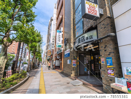 Tokyo cityscape in Japan: Kanda Jinbocho, a used bookstore district lined with shops facing north, catches the afternoon sun for a moment... There are few people around = June 11th 78555381