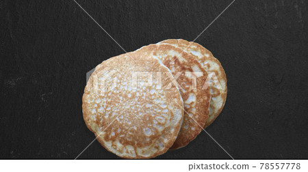 Close up view delicious pancakes isolated on dark table. fit for your design element. 78557778