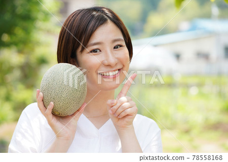 A woman with a melon A woman with a melon 78558168