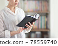 Image of a person reading a book 78559740