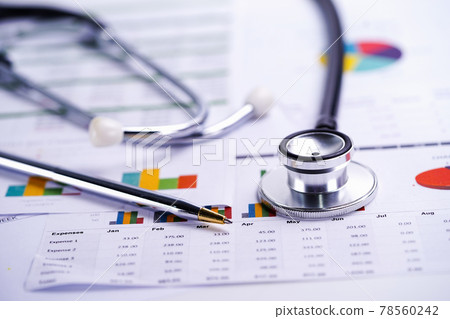 Stethoscope, Charts and Graphs spreadsheet paper, Finance, Account, Statistics, Investment, Analytic research data economy spreadsheet and Business company concept.. Stethoscope, Charts and Graphs spreadsheet paper, Finance, Account, Statistics, Investment, Analytic research data economy spreadsheet and Business company concept.. 78560242