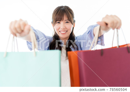Shopping woman with multiple shopping bags 78560504