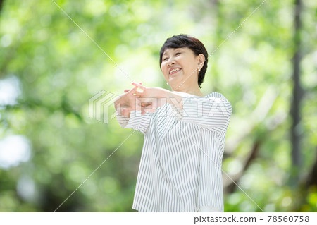 Fresh green senior woman smile stretch stretch 78560758
