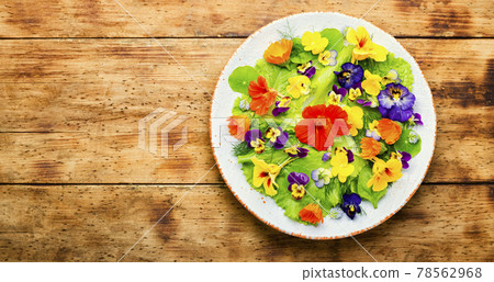 Edible flower salad in the plate,space for text Edible flower salad in the plate,space for text 78562968