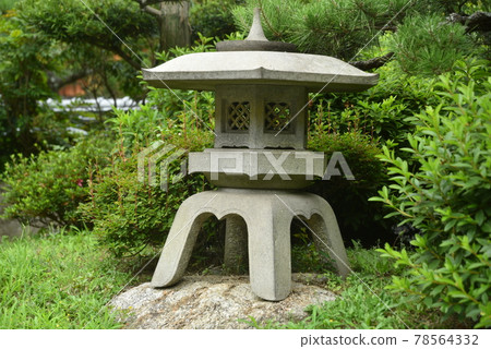 Stone lantern on the stone 78564332