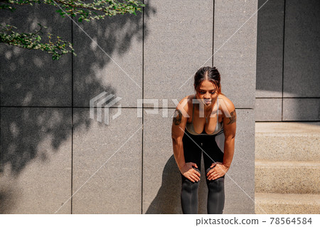 Asian sport girl doing stretching, yoga fitness and plank exercise outside. Fit young thai woman 78564584