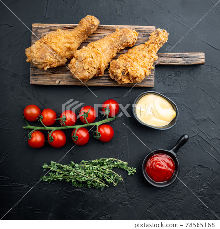 Crispy fried chicken on black background, top view Crispy fried chicken on black background, top view 78565168