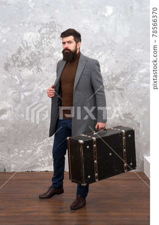 Man well groomed bearded hipster with big suitcase.  78566370