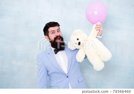 Man wear tuxedo bow tie. Romantic man with teddy bear 78566460