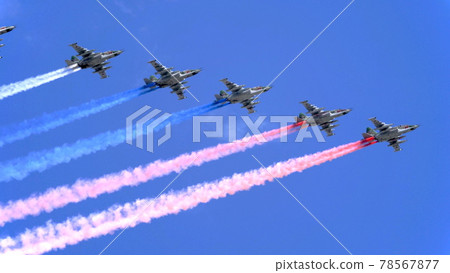 MOSCOW, RUSSIA - MAY 7, 2021: Avia parade in Moscow. Group of Russian fighters Sukhoi Su-25 with painted russian flag in the sky on parade of Victory in World War II in Moscow, Russia 78567877
