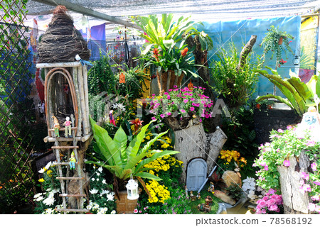 PUTRAJAYA, MALAYSIA -MAY 30, 2016: Small pocket garden made from mix of recycle material and mix of flower at Floria Garden, Putrajaya, Malaysia. PUTRAJAYA, MALAYSIA -MAY 30, 2016: Small pocket garden made from mix of recycle material and mix of flower at Floria Garden, Putrajaya, Malaysia. 78568192