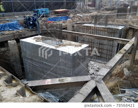 SELANGOR, MALAYSIA -JULY 14, 2016: The concrete pile cap concreted at the construction site in Selangor Malaysia. The pile cap is the part of building foundation. SELANGOR, MALAYSIA -JULY 14, 2016: The concrete pile cap concreted at the construction site in Selangor Malaysia. The pile cap is the part of building foundation. 78568421