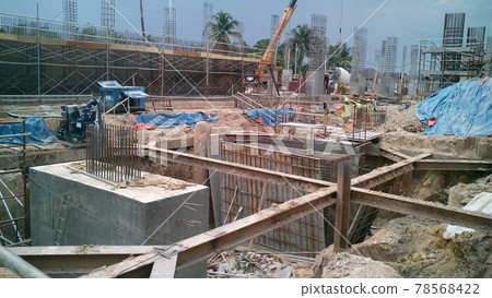 SELANGOR, MALAYSIA -JULY 14, 2016: The concrete pile cap concreted at the construction site in Selangor Malaysia. The pile cap is the part of building foundation. SELANGOR, MALAYSIA -JULY 14, 2016: The concrete pile cap concreted at the construction site in Selangor Malaysia. The pile cap is the part of building foundation. 78568422