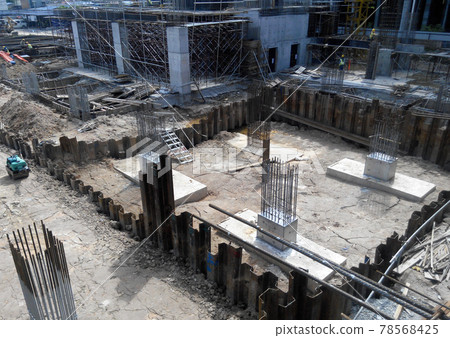 SELANGOR, MALAYSIA -JULY 14, 2016: The concrete pile cap concreted at the construction site in Selangor Malaysia. The pile cap is the part of building foundation. SELANGOR, MALAYSIA -JULY 14, 2016: The concrete pile cap concreted at the construction site in Selangor Malaysia. The pile cap is the part of building foundation. 78568425