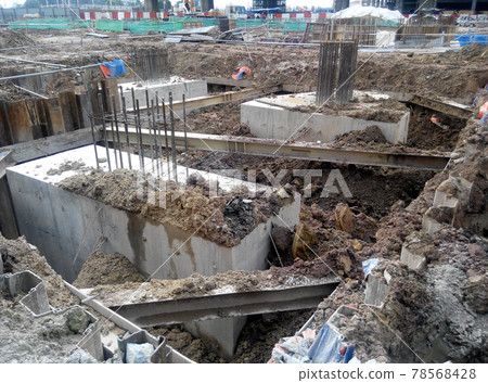 SELANGOR, MALAYSIA -JULY 14, 2016: The concrete pile cap concreted at the construction site in Selangor Malaysia. The pile cap is the part of building foundation. SELANGOR, MALAYSIA -JULY 14, 2016: The concrete pile cap concreted at the construction site in Selangor Malaysia. The pile cap is the part of building foundation. 78568428