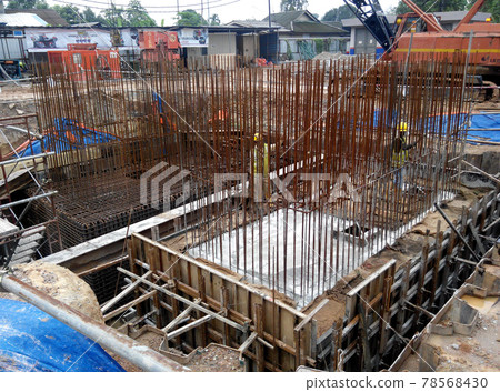 SELANGOR, MALAYSIA -JULY 14, 2016: The concrete pile cap concreted at the construction site in Selangor Malaysia. The pile cap is the part of building foundation. SELANGOR, MALAYSIA -JULY 14, 2016: The concrete pile cap concreted at the construction site in Selangor Malaysia. The pile cap is the part of building foundation. 78568430