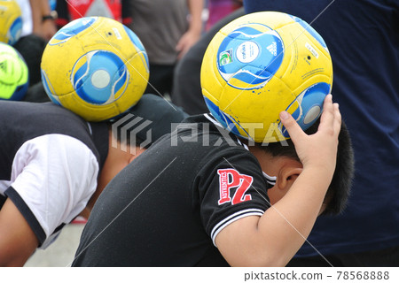 SELANGOR, MALAYSIA -SEPTEMBER 6, 2015: Children undergoing football training. Just wear casual clothing rather than sportswear. 78568888