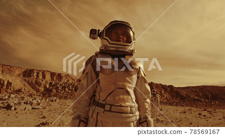Astronauts searching location for base on Mars Astronauts searching location for base on Mars 78569167