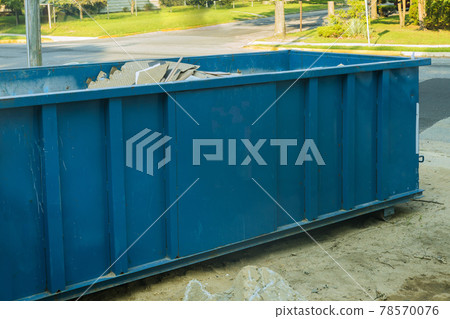 Industrial dumpster filled loaded rubbish removal container renovation building 78570076
