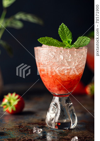Fresh cocktail with crushed ice, strawberry and mint 78571900
