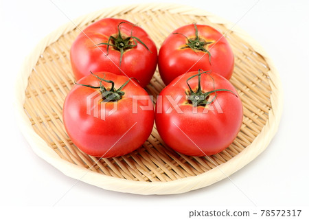 Tomato on bamboo colander white background white background 78572317
