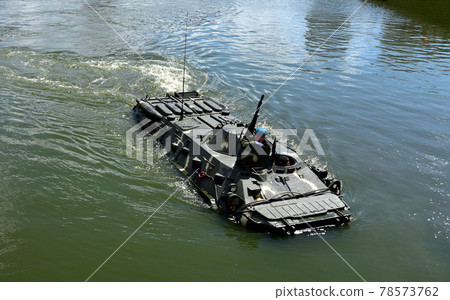 Sailing on BTR APC Amphibious Armoured Personnel Carrier.  78573762