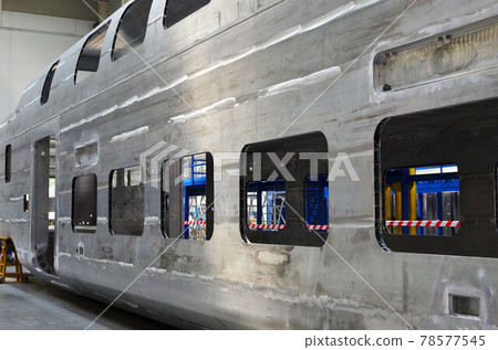 Inside of the rail car assembly plant. Industrial workshop for welding aluminum bodys.  78577545