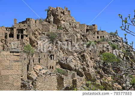 Abandoned village Gamsutl at the top of the mountain peak in Dagestan, Russia Abandoned village Gamsutl at the top of the mountain peak in Dagestan, Russia 78577883