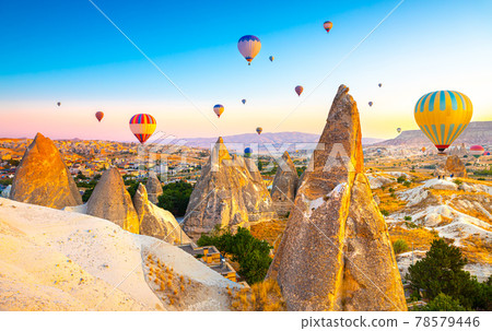Sunrise view of unusual rocky landscape in Cappadocia, Turkey 78579446
