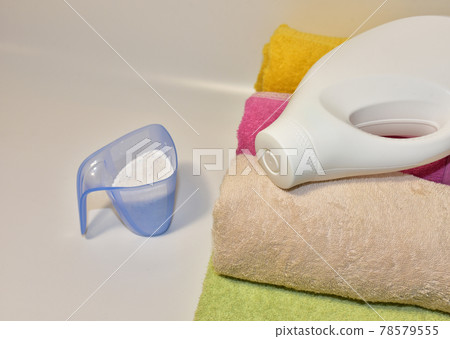 Detergent laundry bottle for washing clothes. Household for cleaning in laundry room.  78579555