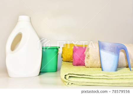 Detergent laundry bottle for washing clothes. Household for cleaning in laundry room. Detergent laundry bottle for washing clothes. Household for cleaning in laundry room. 78579556