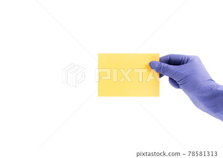 Women's hands i medical gloves hold swatches of the trendy color - illuminating yellow. Selection of year 2021 colors for design of clothes, interiors, websites and publications. 78581313