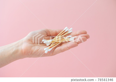 environmentally friendly bamboo and cotton cotton buds on a pink background, bamboo toothbrushes for adults and children. human personal hygiene products without harming the environment 78581346