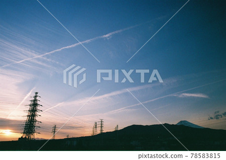 Sunset and tower and mountain silhouette Sunset and tower and mountain silhouette 78583815