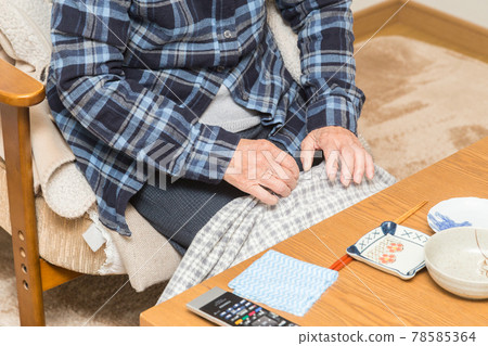 Senior woman eating supper 78585364