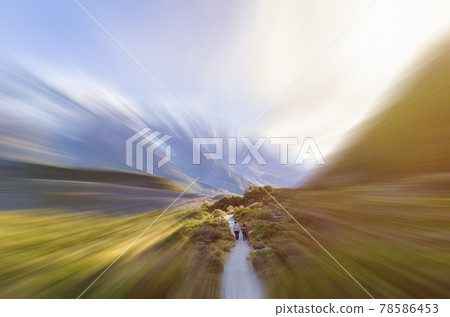 Travelers can seen trekking to the Mount Cook National Park,New Zealand in motion blur. Travelers can seen trekking to the Mount Cook National Park,New Zealand in motion blur. 78586453