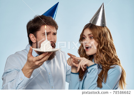 Birthday cake with candle man and woman corporate party fun holidays Birthday cake with candle man and woman corporate party fun holidays 78586682