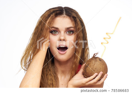 Beautiful woman with coconut cocktail in hands wavy hair cosmetics attractive look lifestyle leisure Beautiful woman with coconut cocktail in hands wavy hair cosmetics attractive look lifestyle leisure 78586683