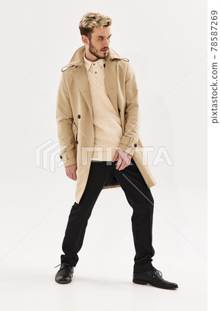 man with trendy hairstyle in beige coat modern style man with trendy hairstyle in beige coat modern style 78587269